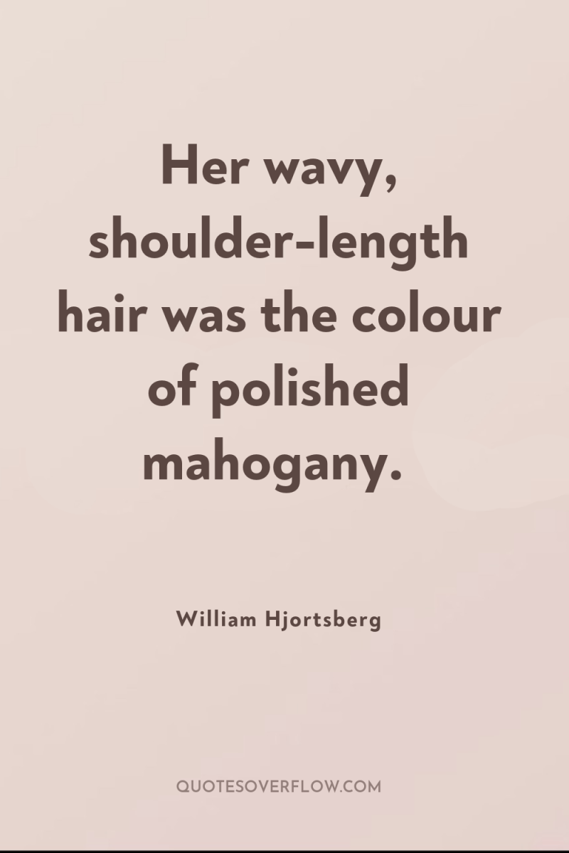 Her wavy, shoulder-length hair was the colour of polished mahogany. 